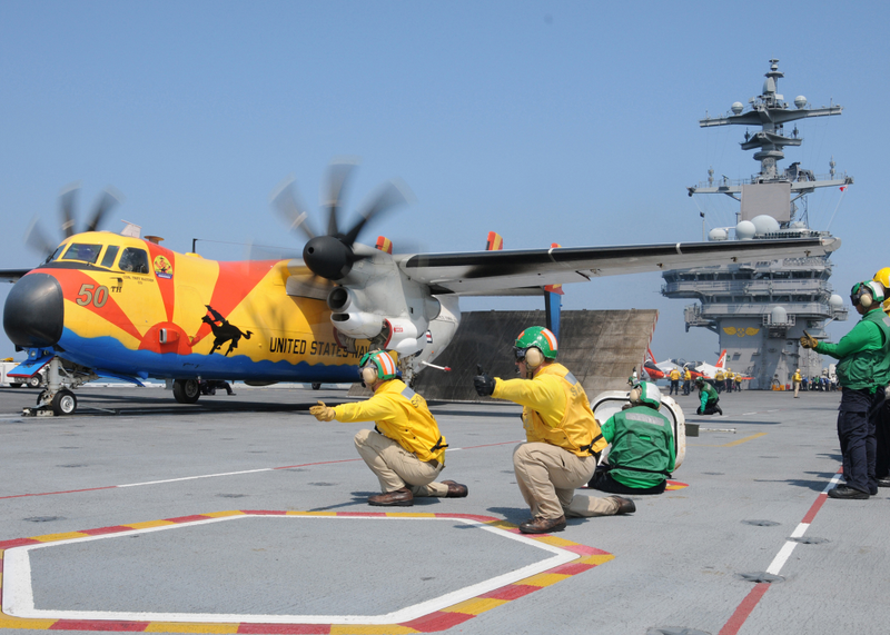 New Mexico State flag painted C-2A Carrier COD or carrier onboard delivery plane... derived from the E-2 Hawkeye. These planes art to be replaced by USN specific V-22 Osprey.